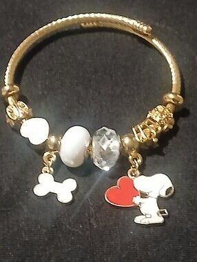 Peanuts -Snoopy Charm Bracelet, 8 charms on Adj. Cuff Style Gold Tone Bracelet